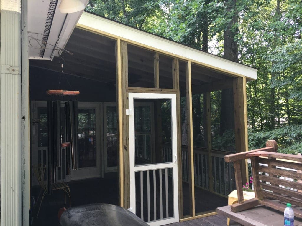 Screened porch addition with wooded mountain view by Blue Ridge Homes